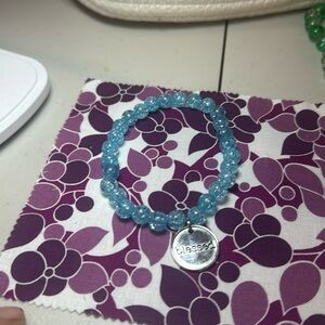 Beautiful blue bracelet with the charm blessed